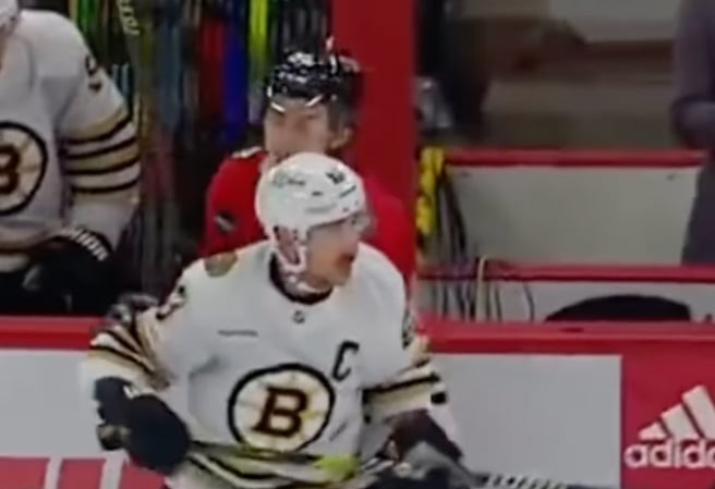 Brad Marchand goes after Connor Bedard again in Bruins-Hawks 2nd game of the season