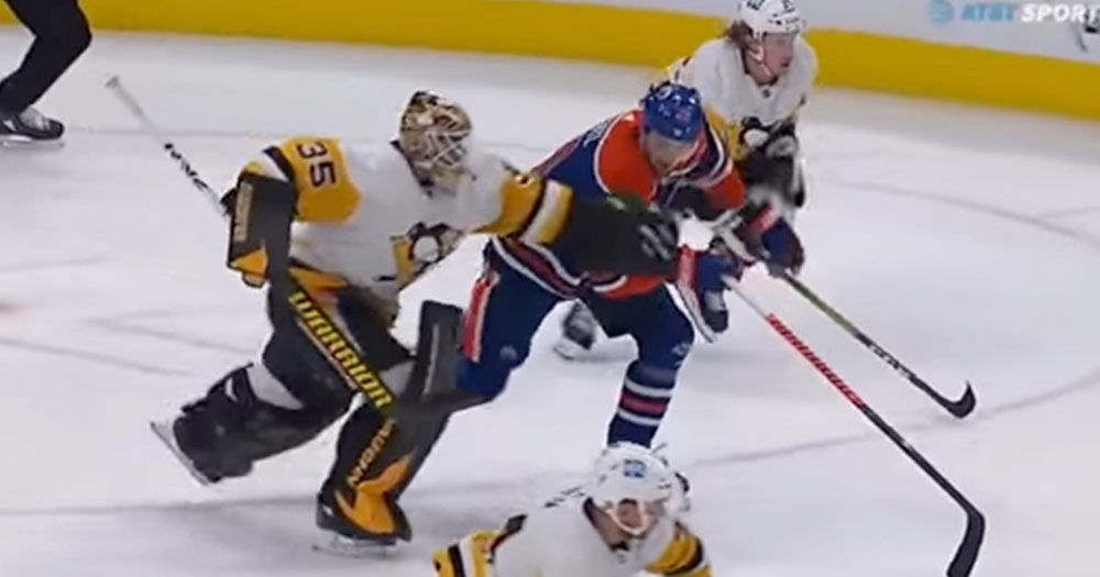 Tristan Jarry takes Leon Draisaitl out with crazy leg sweep in the neutral zone