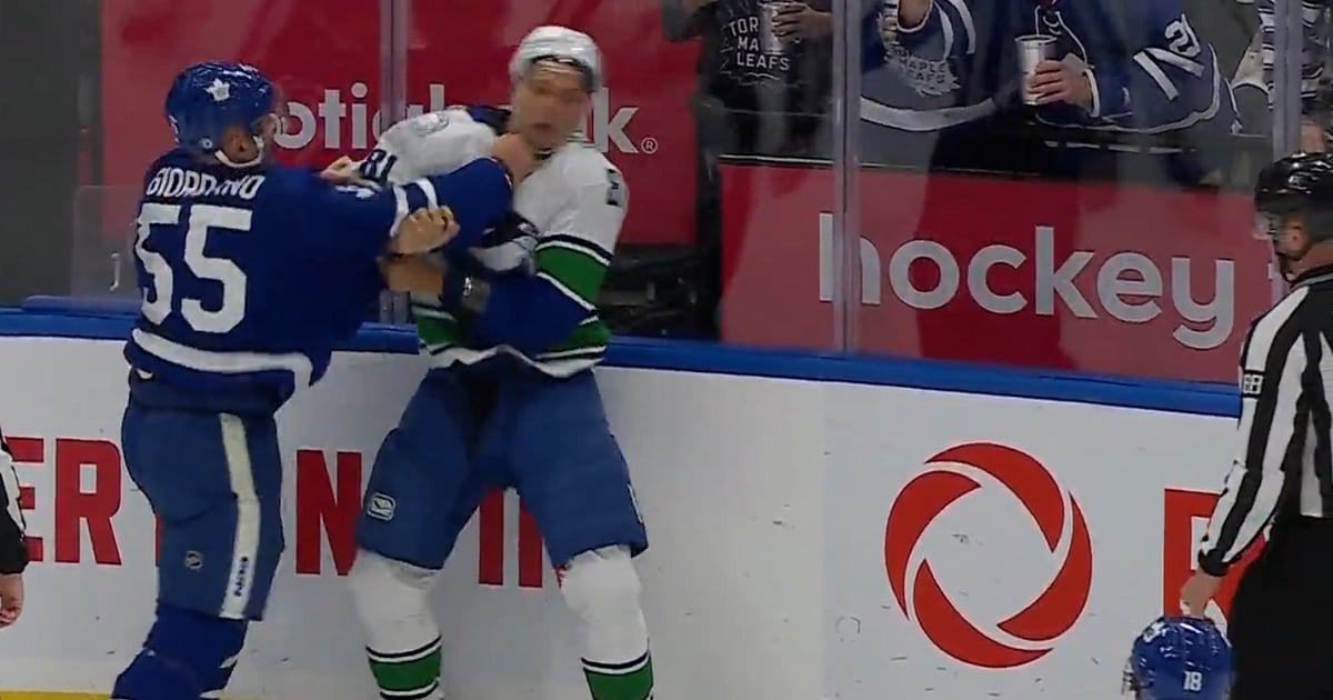 Mark Giordano drops the gloves with Dakota Joshua.