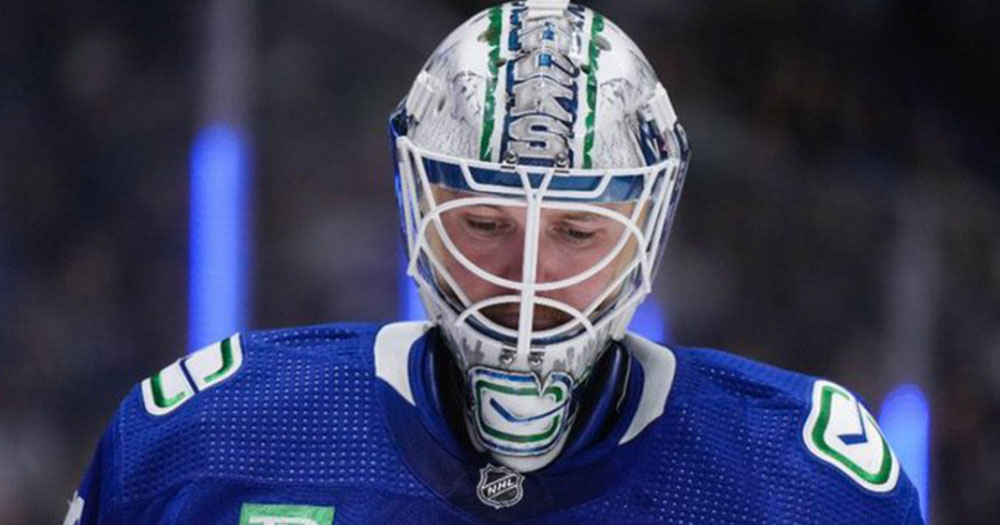 Canucks goalie Thatcher Demko pukes in his own mask during play