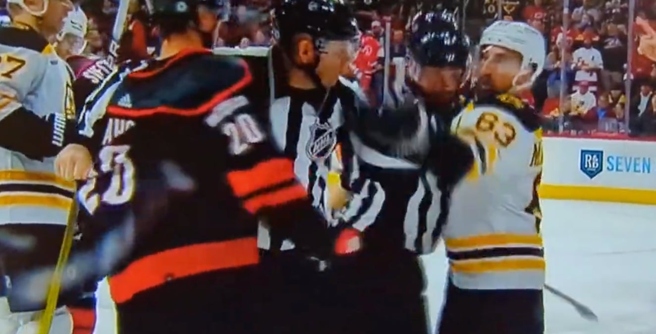 Brad Marchand accidentally slaps the linesman! 