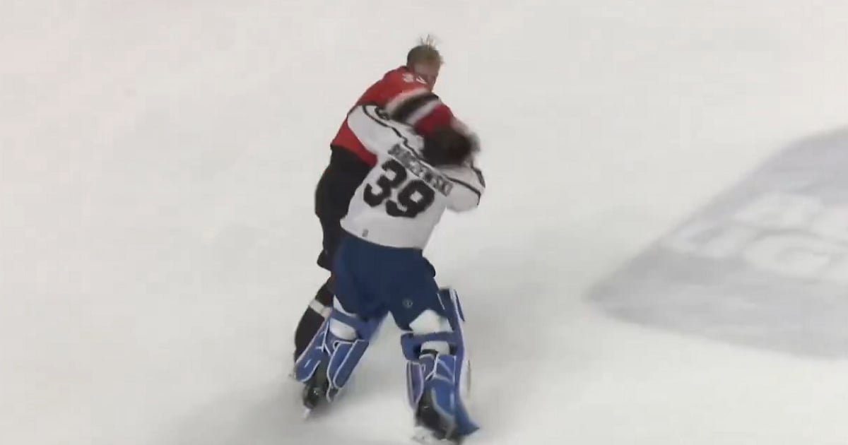 Goalie helped off the ice after challenging the wrong man to a fight.