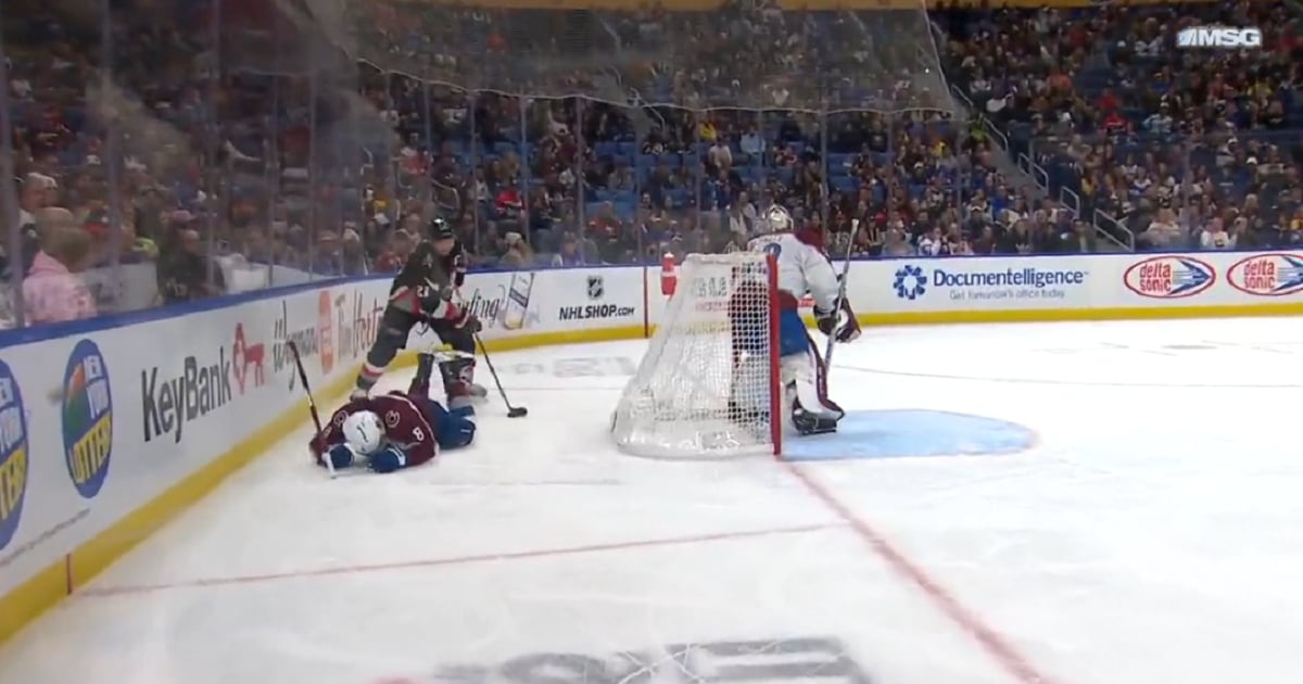 Kyle Okposo sends Cale Makar face first into the boards.