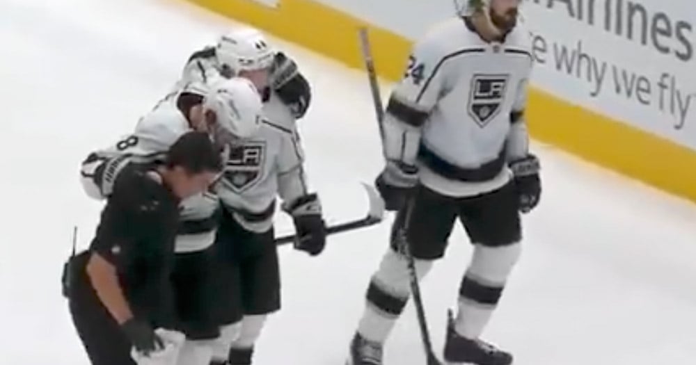 Drew Doughty helped off the ice after taking DIRTY knee on knee hit! 