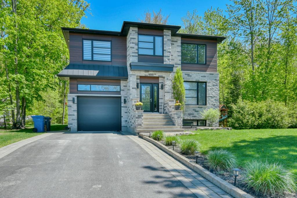 Superbe cottage contemporain à concept ouvert dans un secteur familial en pleine nature et tout près des services 